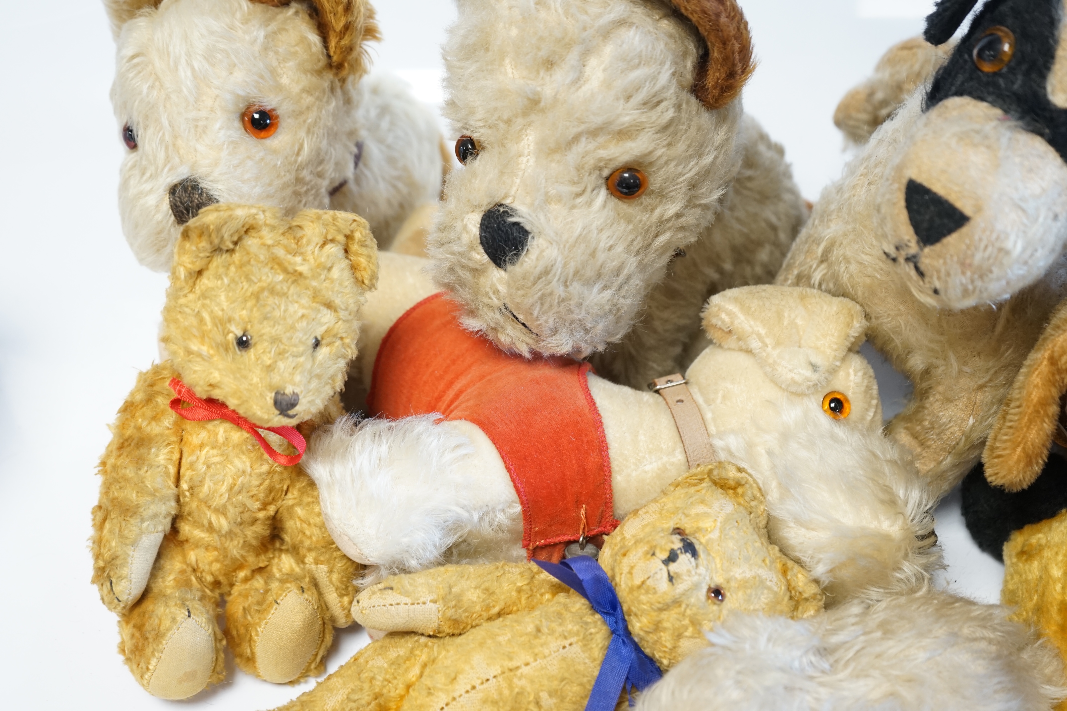 Four Merrythought dogs and three others, c.1950's, together with three cotton plush bears and one rabbit (11). Condition - fair